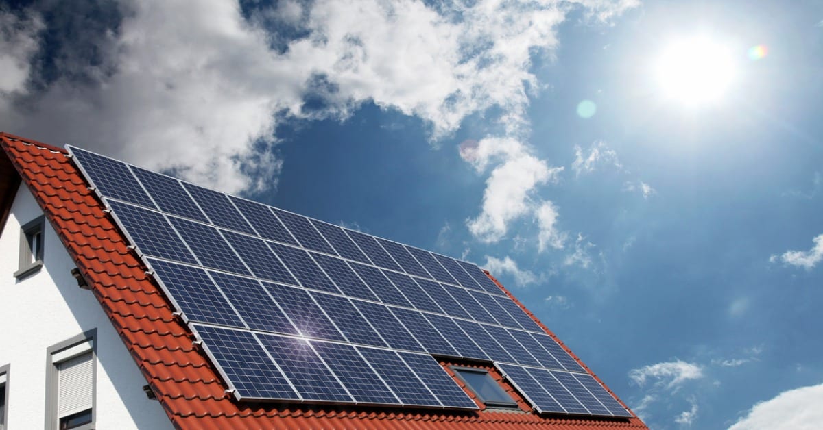 eco-friendly home with solar panels on roof